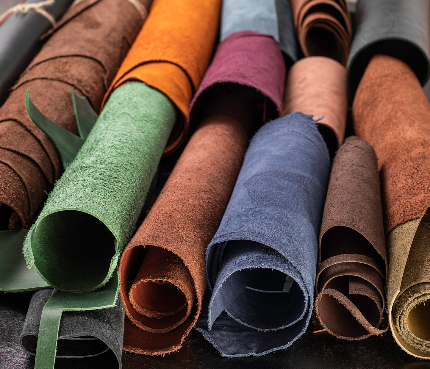 Photo of a variety of leathers in different colors that can be used for shoemaking