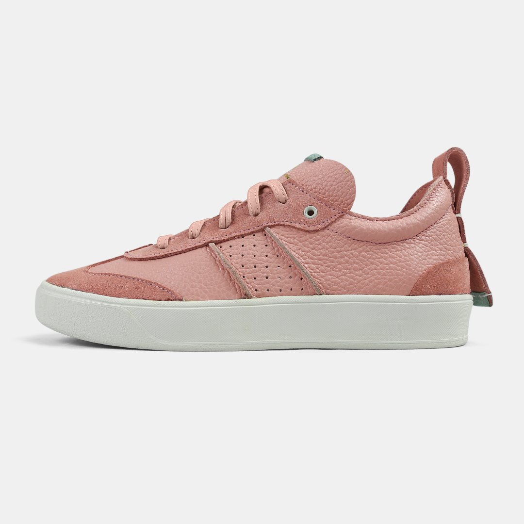 A pink women's sneaker with a lace-up closure, made from Italian leather, with a rubber cupsole.