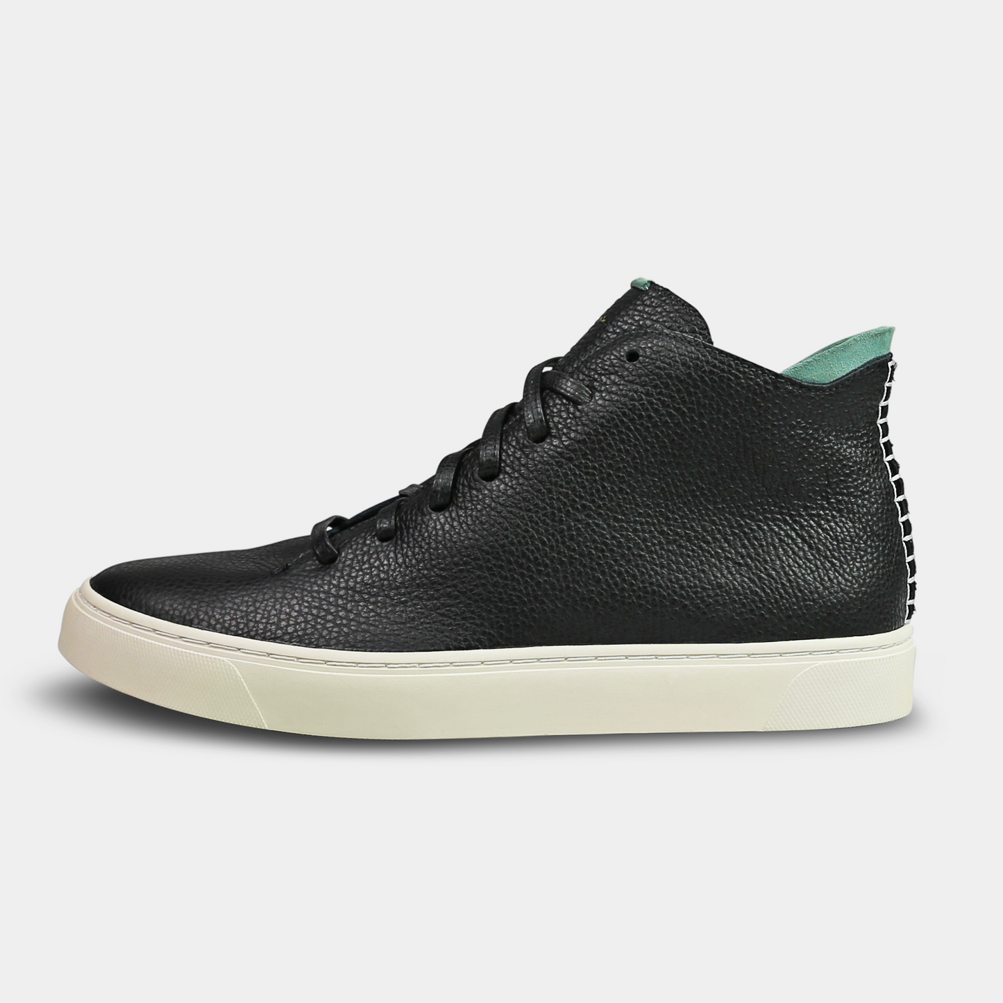 A black, mid-top sneaker with a leather upper, lace-up closure, and a white sole lateral view