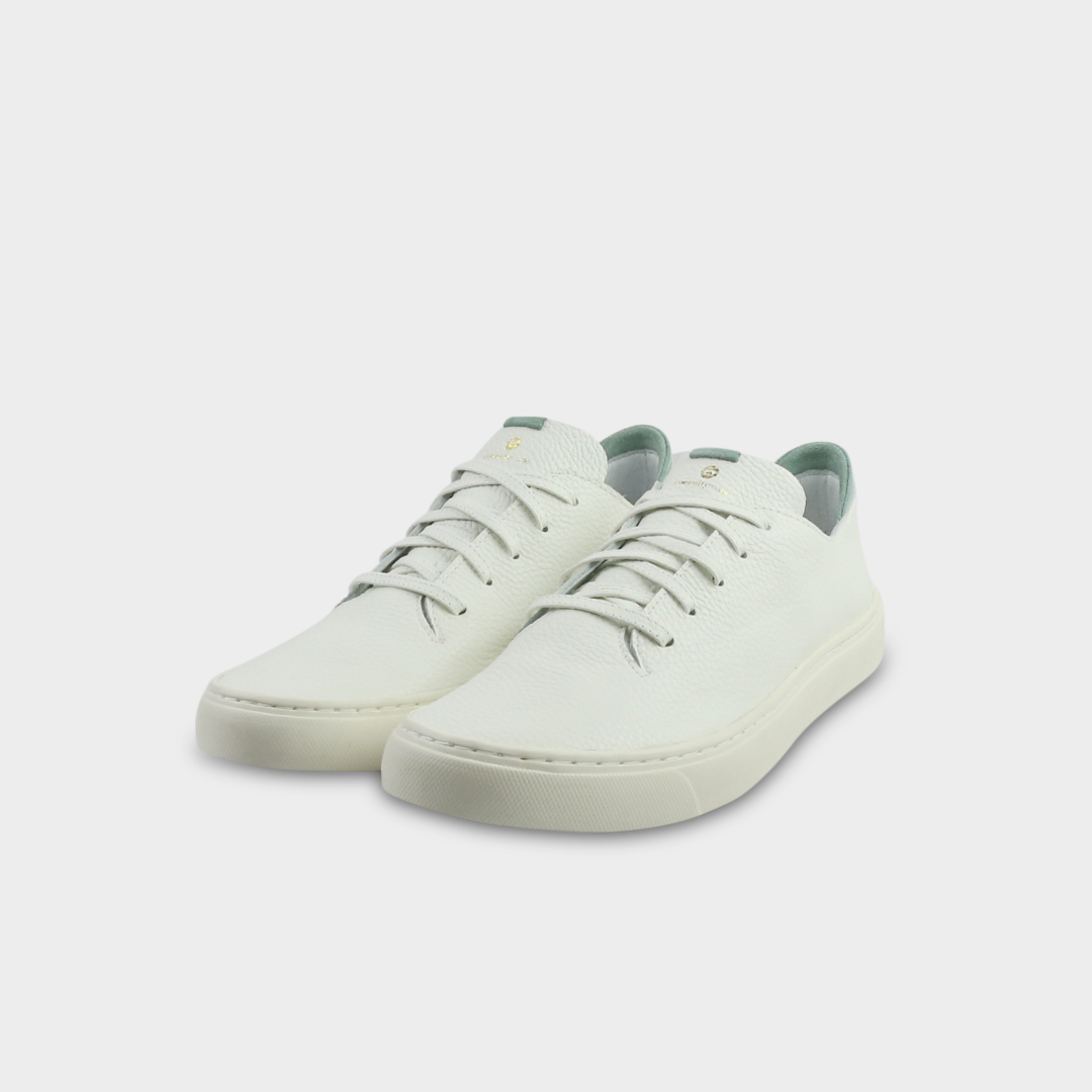 A women's sneaker in off-white color, made of Italian full grain leather, with a lace-up closure quarter view